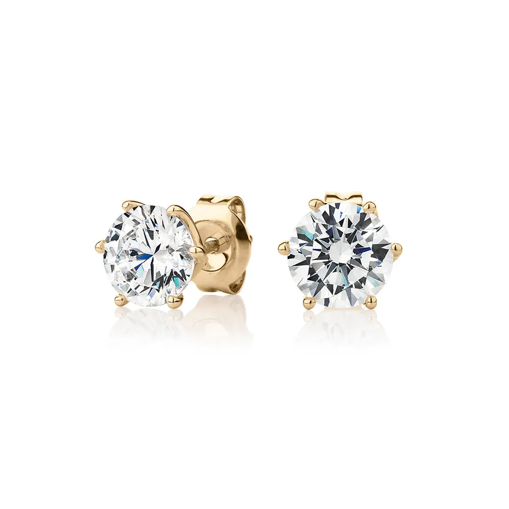 Round Brilliant stud earrings with 2 carats* of diamond simulants in 10 carat yellow gold