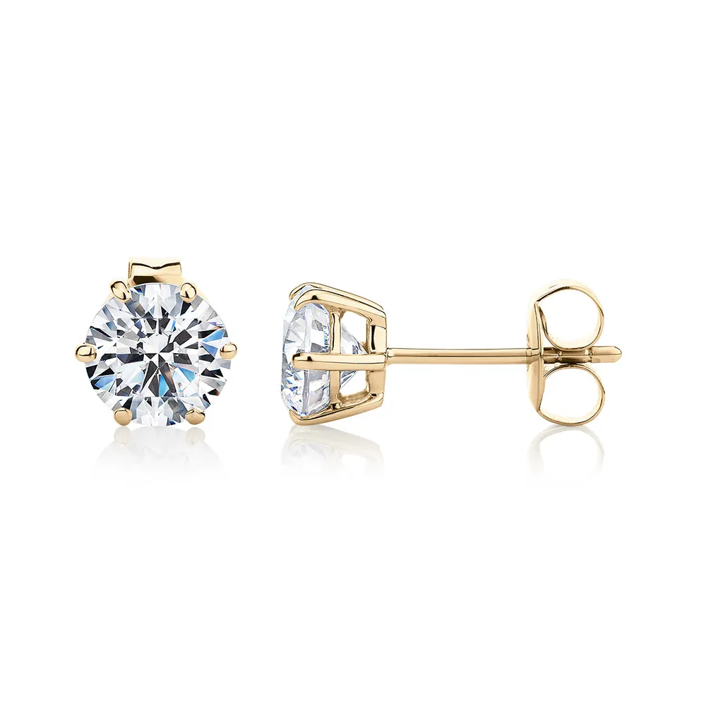 Round Brilliant stud earrings with 2 carats* of diamond simulants in 10 carat yellow gold